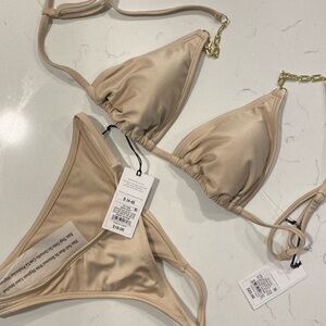 Beige bikini with gold chain accent